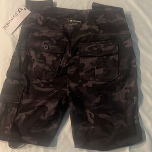 NWT Firm Abs Leggings, size large. 1 black and grey camo and 1 orange.